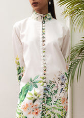 A woman modeling a floral print co-ord set with a mandarin collar and flared trousers.
LaRosa Summer Dreams Delia white cotton loungewear set for women.
closeup